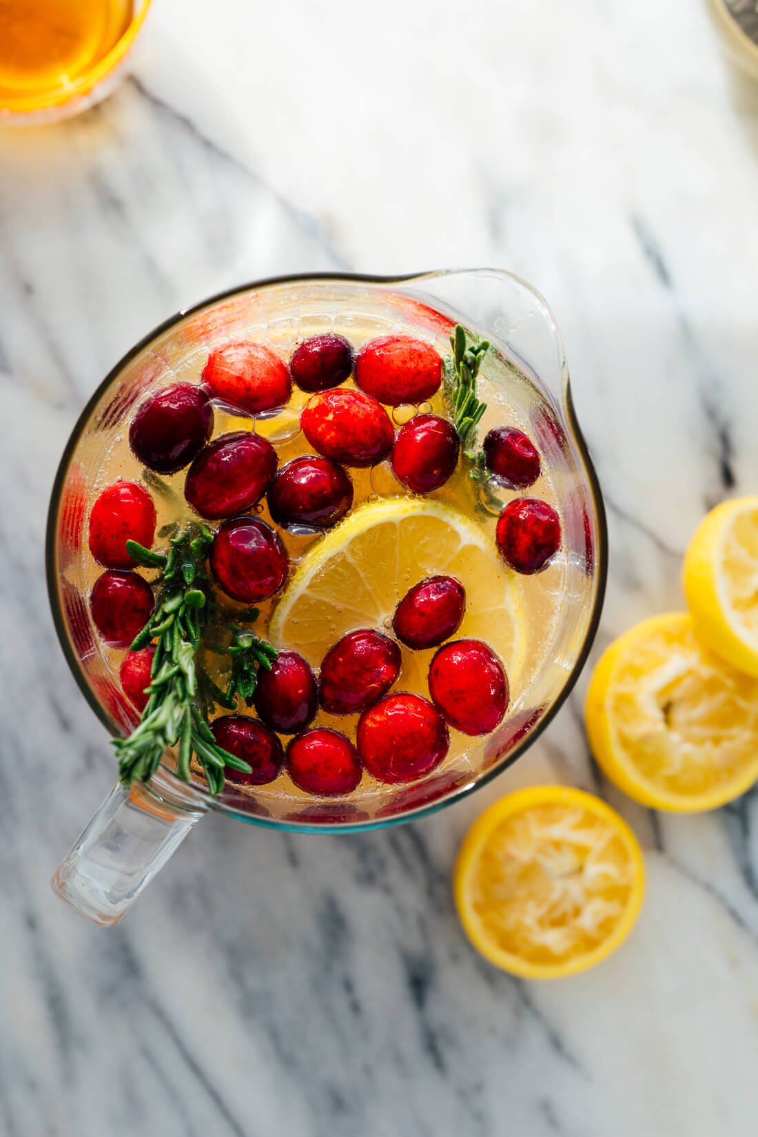 holiday punch with cranberries and rosemary
