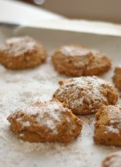 baked pumpkin cookies topped with powdered sugar